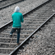 An amputee makes his way along the tracks outside Guwahati Junction, Assam.